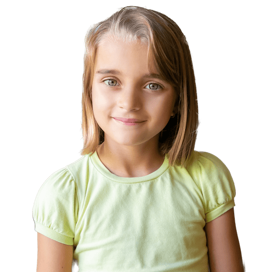 A smiling young girl looking at the camera.