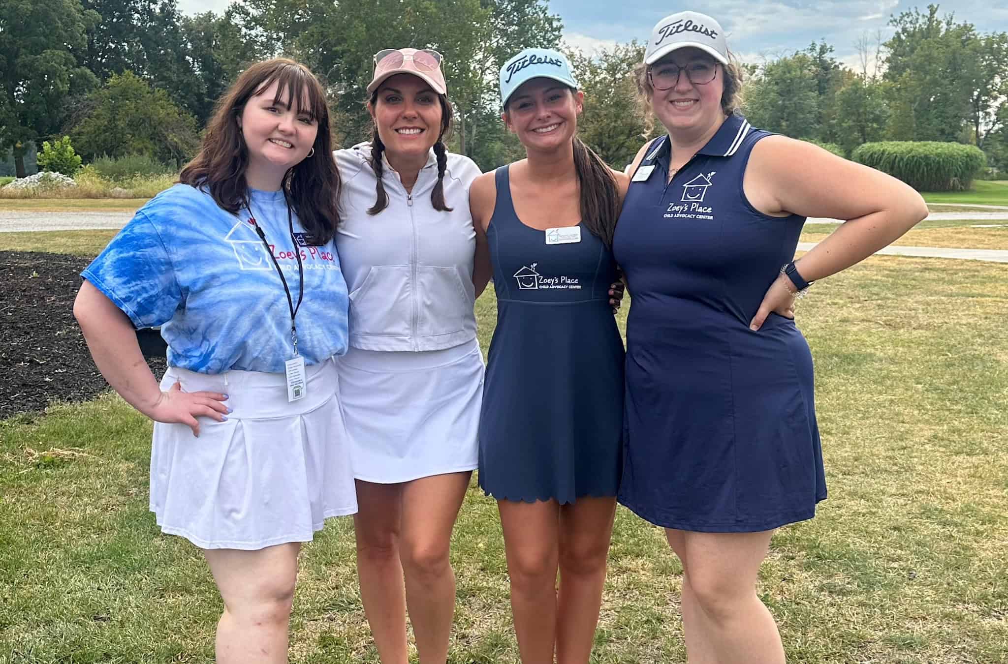 The Zoey's Place staff pose on the golf course