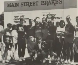 Students pose outside Main Street Brakes, Greenfield H.S. Catamount, 1987