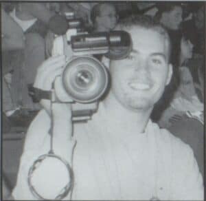 Cameraman Clay Partin takes a break from taping a girls volleyball game. Photo B. Dyer, Eastern Hancock, 2001